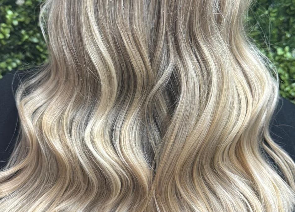 Blonde wavy hair styled at Hair and Beauty Hub, Kettering, England, GB, showcasing vibrant and healthy texture.