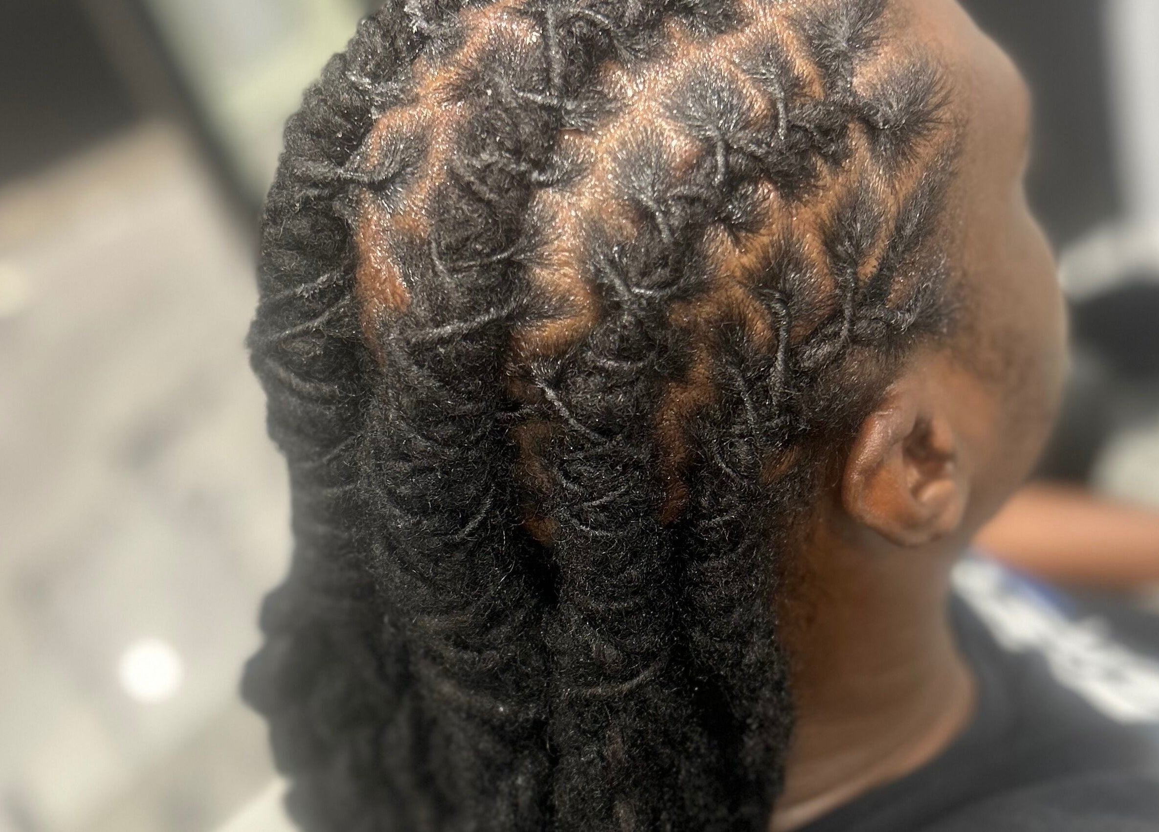 Stylish braided hairstyle at Styledbyshan, South Croydon, England, GB showcasing intricate patterns.