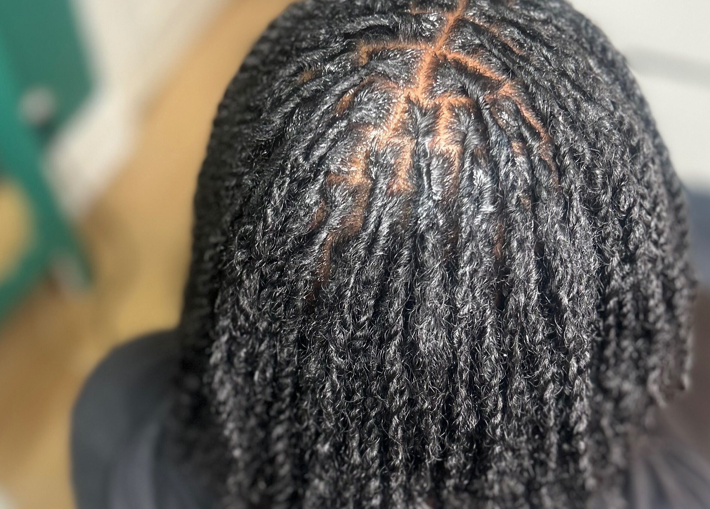 Detailed twist hairstyle at Styledbyshan in South Croydon, England, GB, showcasing intricate braiding technique.