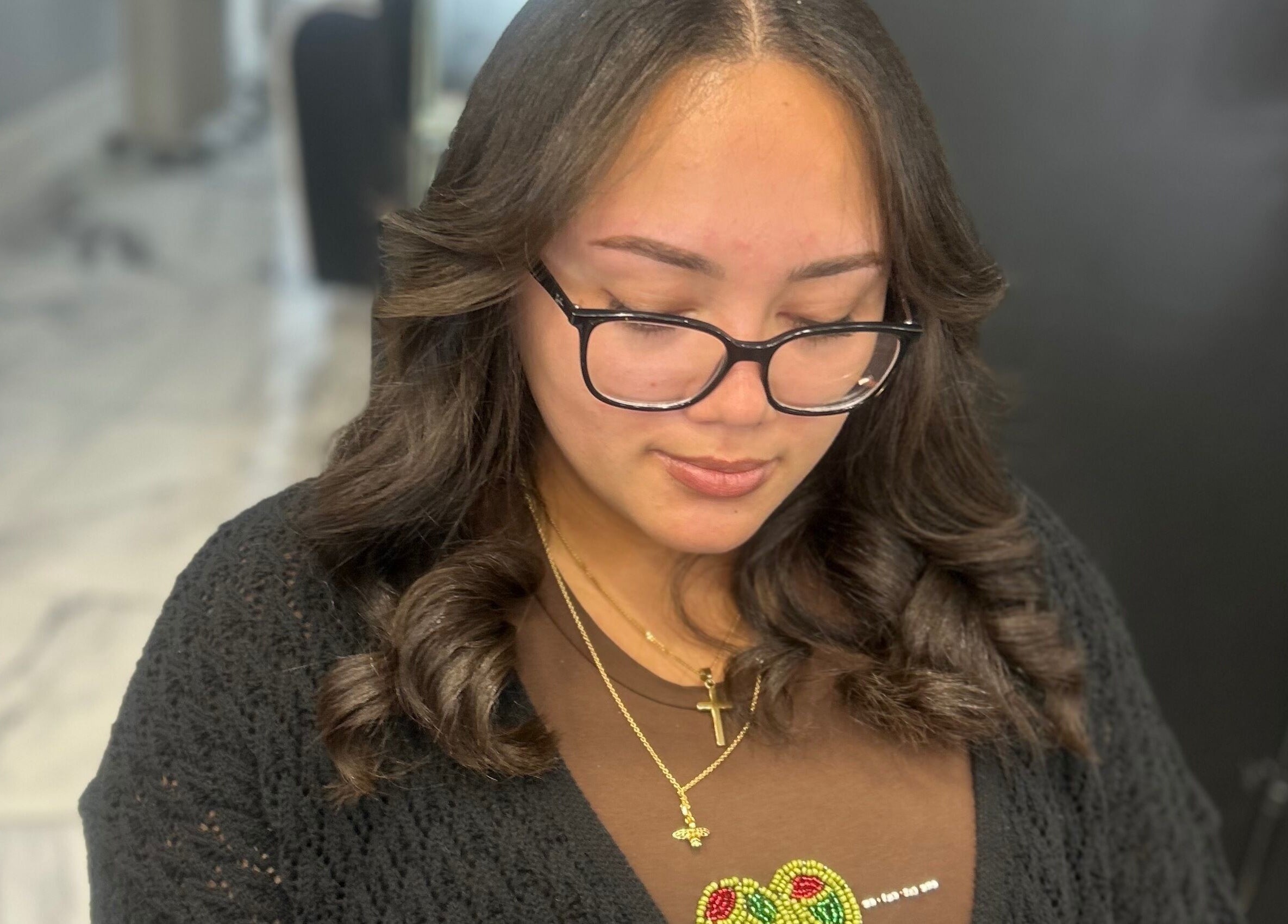 Woman with styled hair at Styledbyshan, South Croydon, England, GB. Showcasing expert styling in a chic setting.