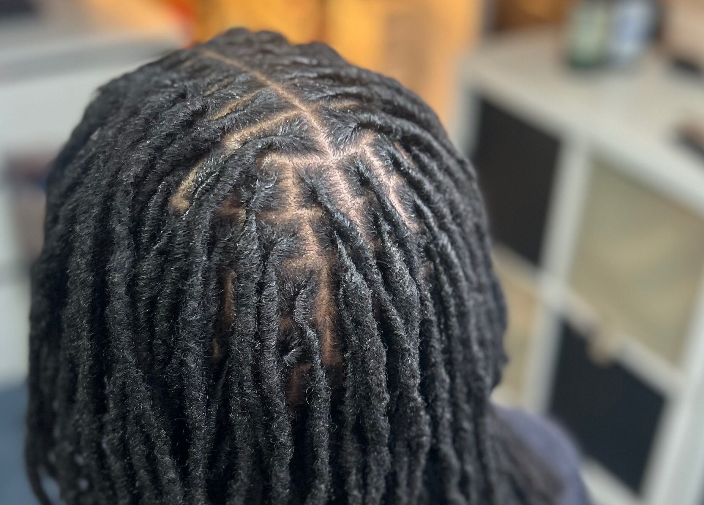 Beautifully styled locs at Styledbyshan in South Croydon, England, GB.