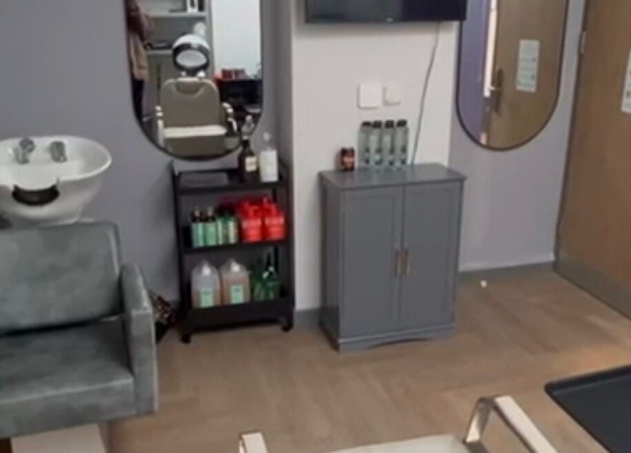 Cozy salon corner at Styledbyshan, South Croydon, England, GB, featuring a wash basin and modern decor.