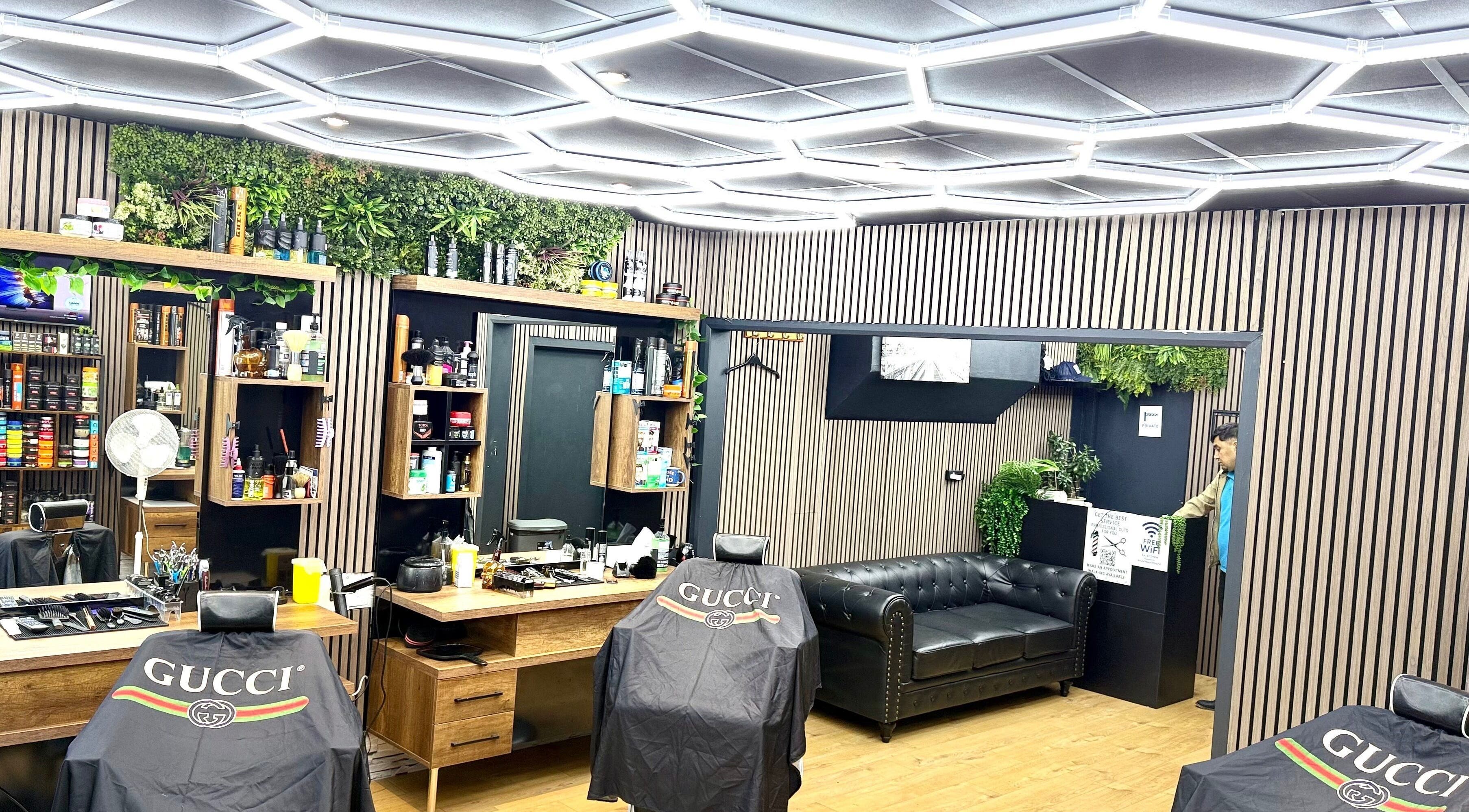 Modern interior of Fine Cutz Barber in Brighton And Hove, England, GB with stylish decor and seating.