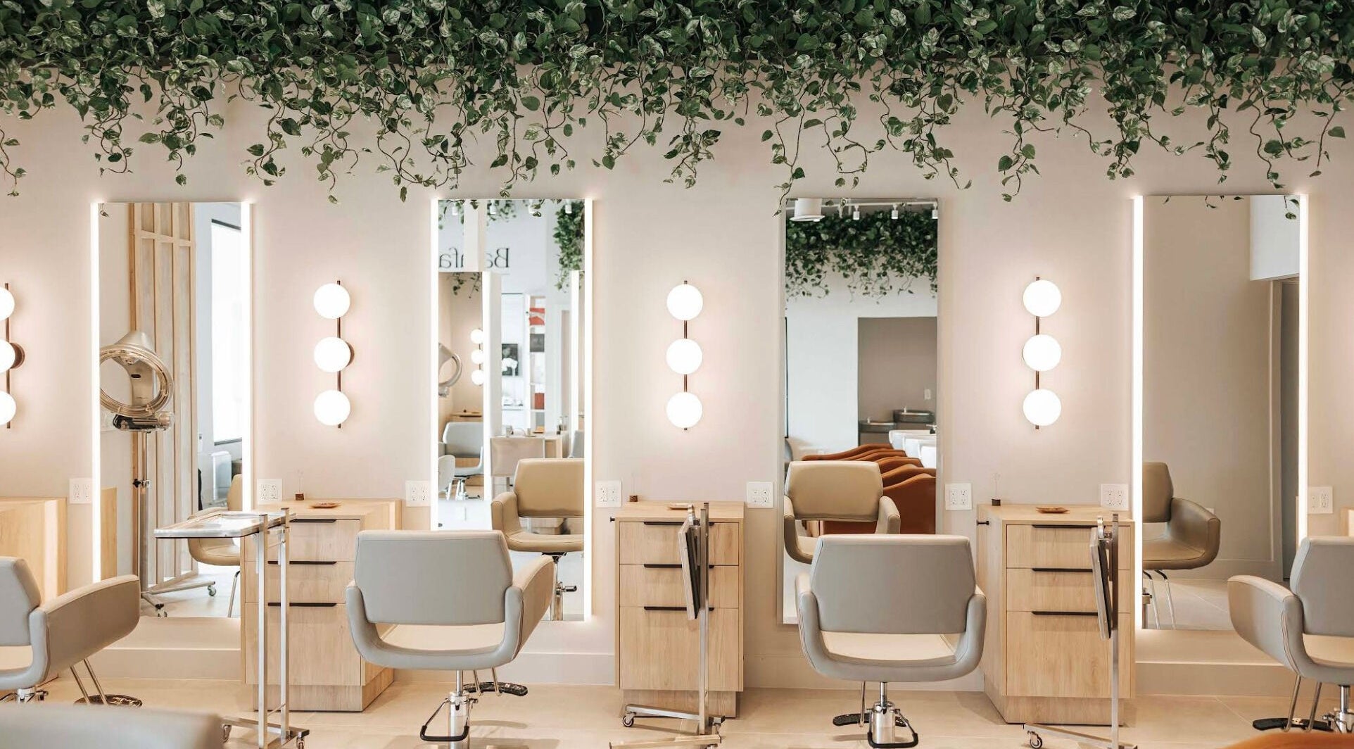 Elegant salon setup at BFF Head & Hair Therapy, Boca Raton, Florida, US, featuring stylish chairs and mirrors.