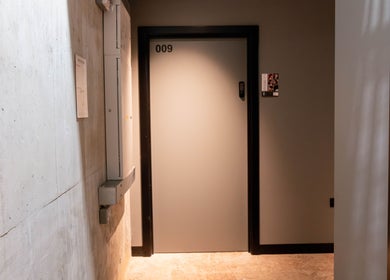 Entrance to Studio 211 - Hair, located at 009, London, England, GB. Elegant and modern interior design.
