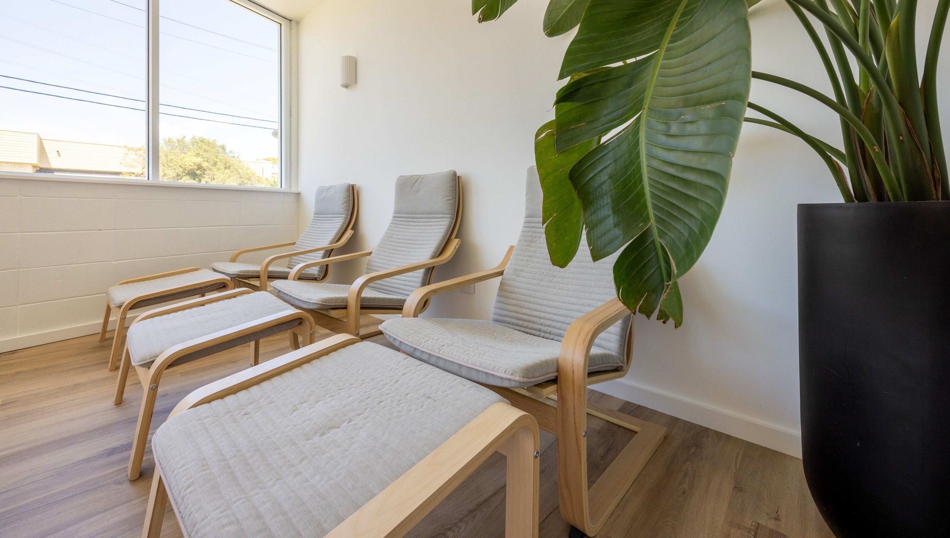 Relaxing lounge chairs at Sweat Chill Exhale, Caringbah, New South Wales, AU, bathed in natural light.