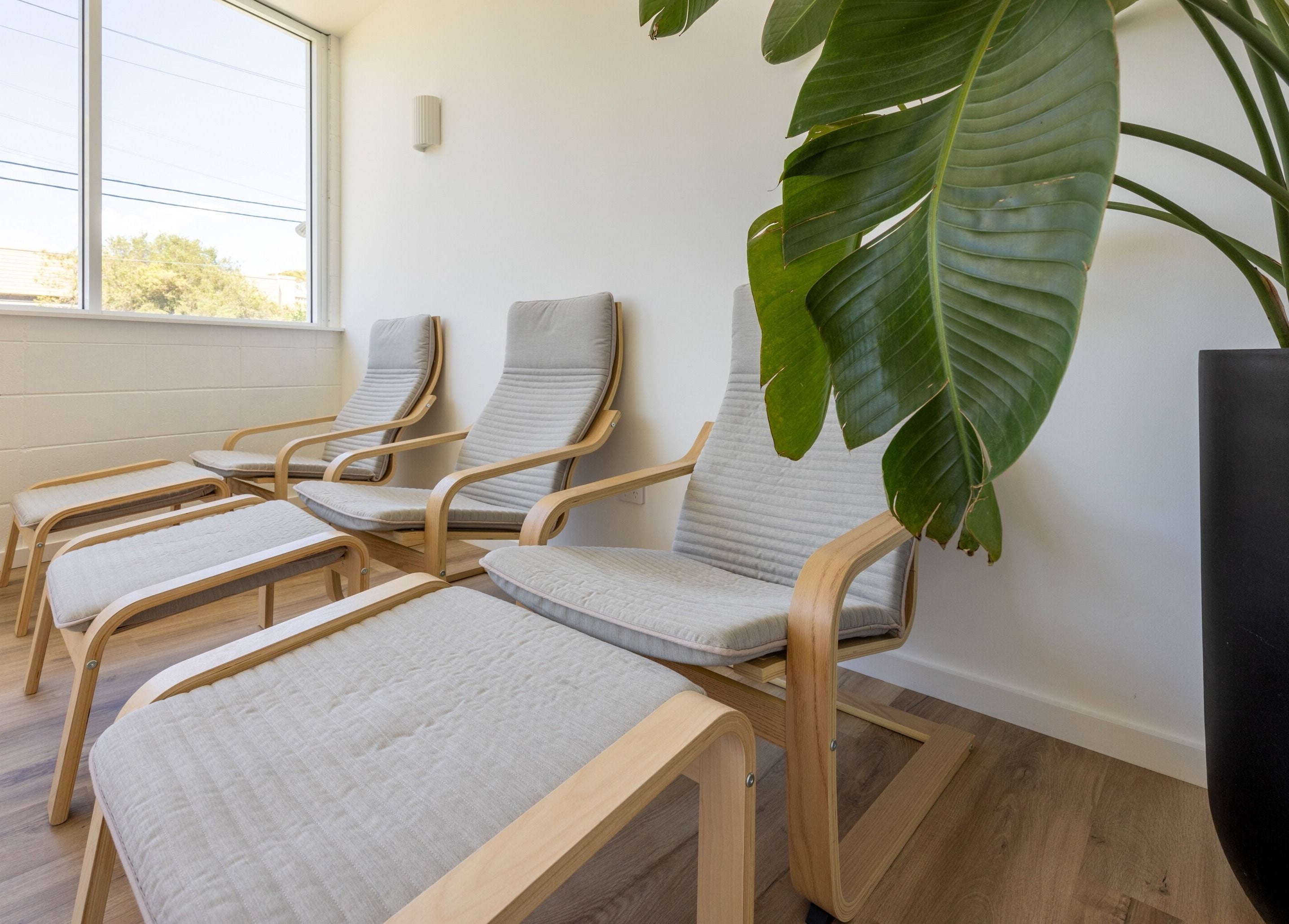 Relaxing lounge chairs at Sweat Chill Exhale, Caringbah, New South Wales, AU, bathed in natural light.