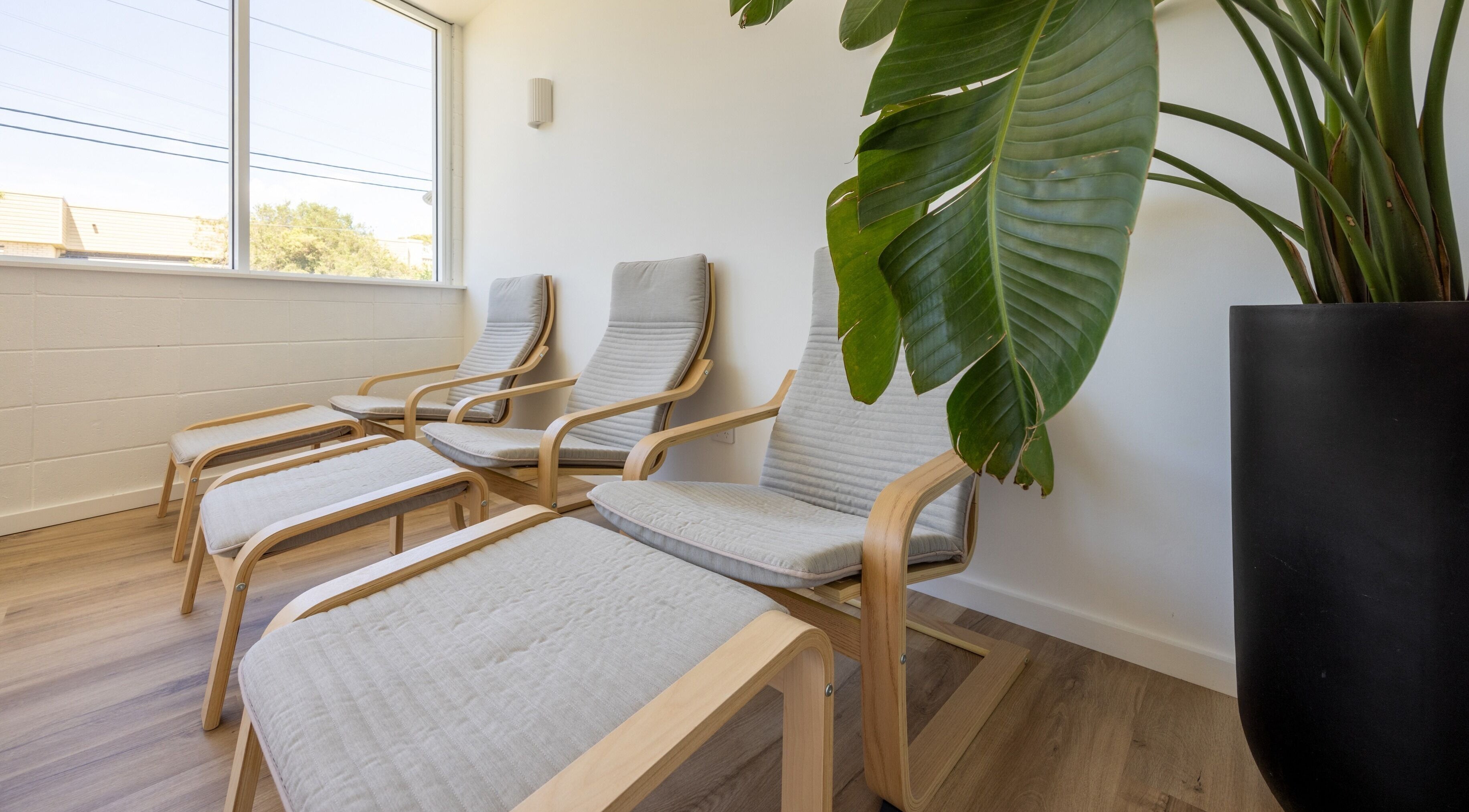 Relaxing lounge chairs at Sweat Chill Exhale, Caringbah, New South Wales, AU, bathed in natural light.