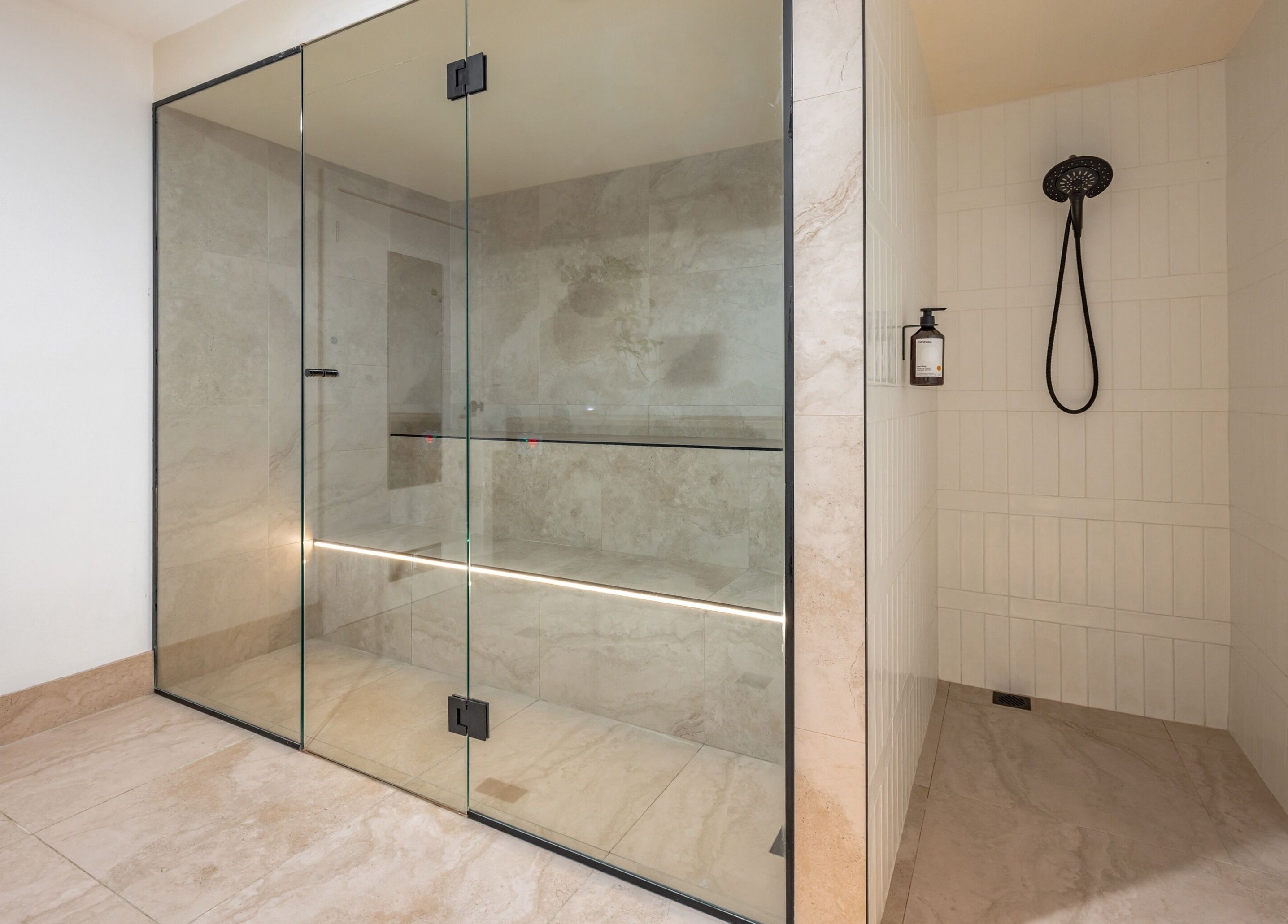 Modern glass steam room at Sweat Chill Exhale in Caringbah, New South Wales, AU, exemplifies luxury and relaxation.