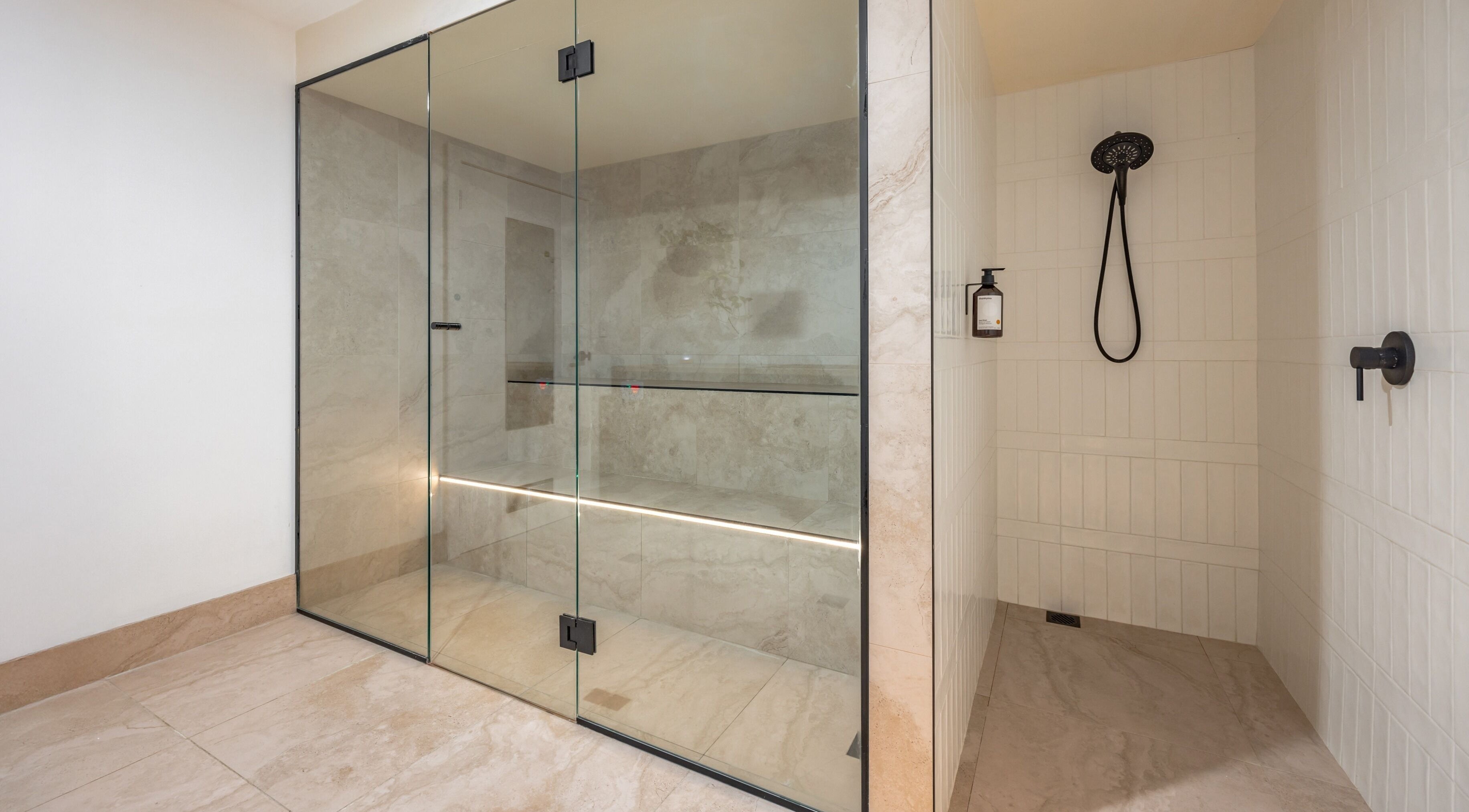 Modern glass steam room at Sweat Chill Exhale in Caringbah, New South Wales, AU, exemplifies luxury and relaxation.