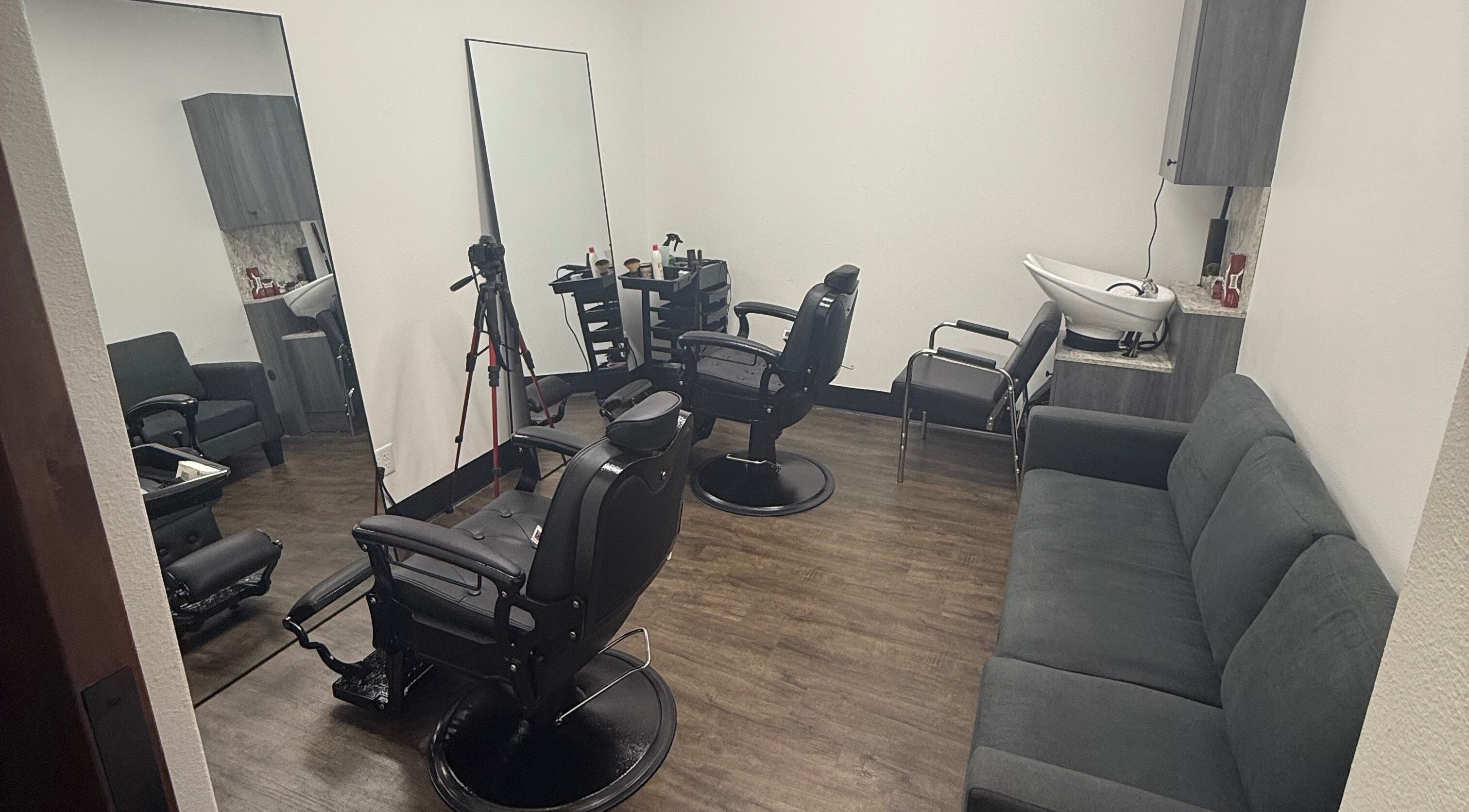 Contemporary salon interior at Sandy Porben, Miami, Florida, US, with modern chairs and styling equipment.