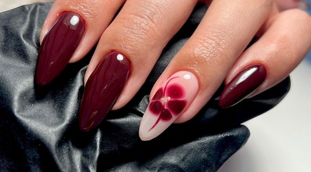 Elegant deep red and floral nail design by Nails By Jess, St Austell, England, GB.