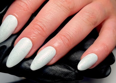 Stunning pearl-white nails with matte finish at Nails By Jess, St Austell, England, GB.