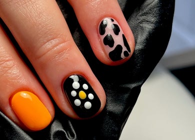 Vibrant nail art at Nails By Jess in St Austell, England, GB, featuring bold patterns and colors.