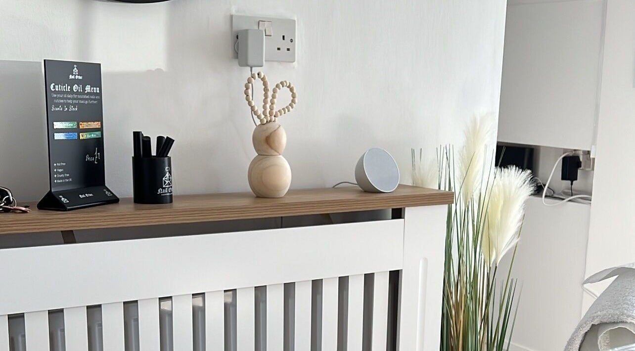 Stylish decor at Nails By Jess, St Austell, England, GB with a cuticle oil menu and modern design.