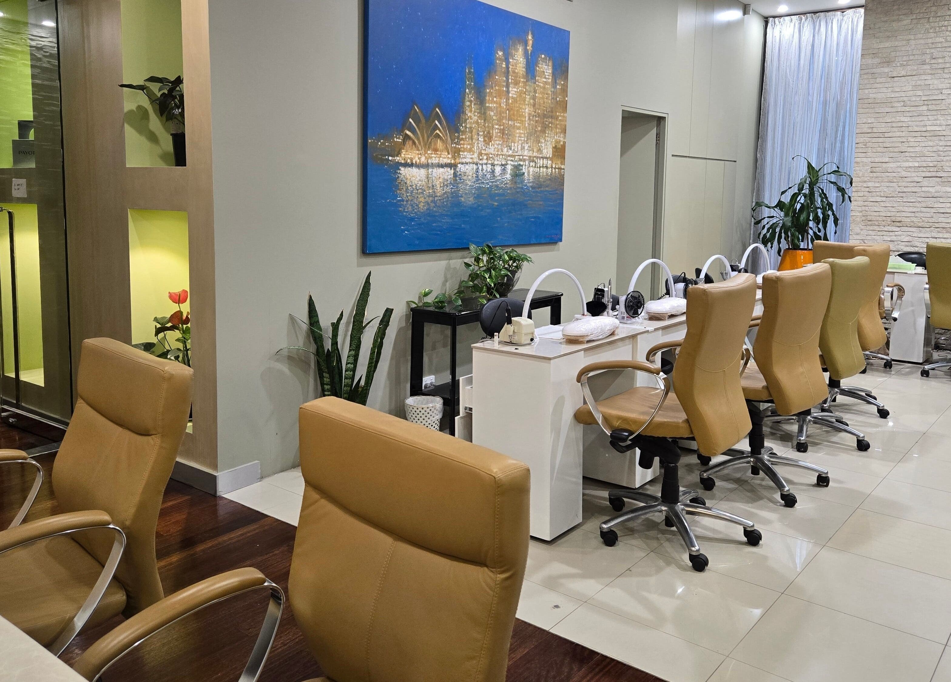 Chic interior of Glow District Beauty, Sydney, NSW, showcasing modern salon chairs and decor.