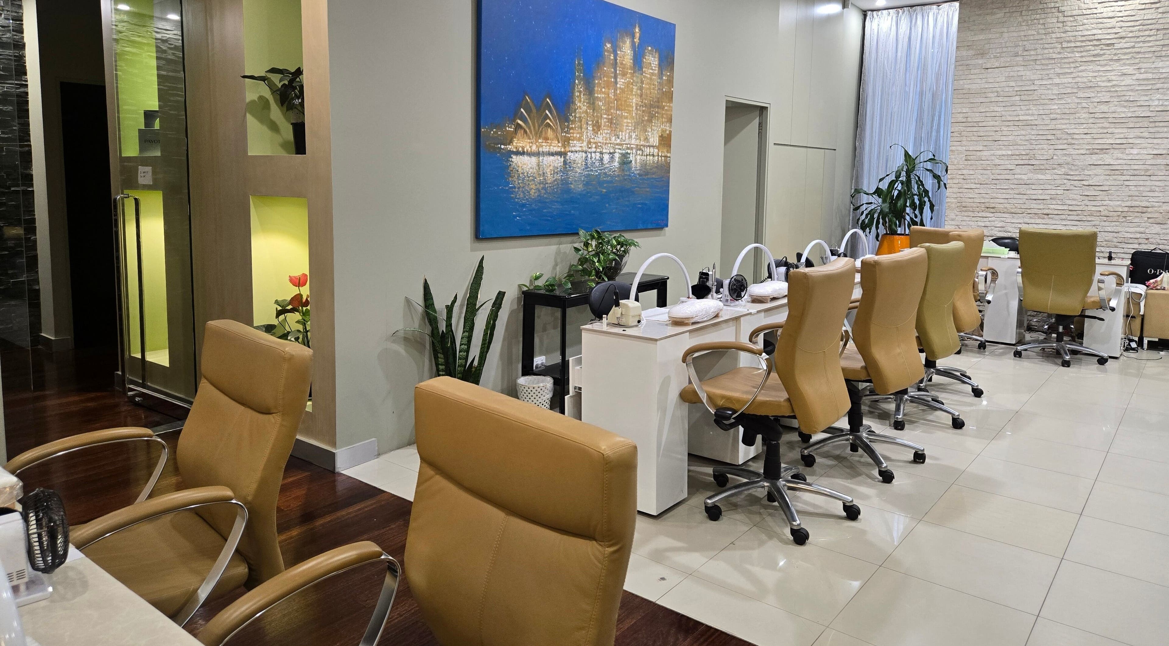 Chic interior of Glow District Beauty, Sydney, NSW, showcasing modern salon chairs and decor.