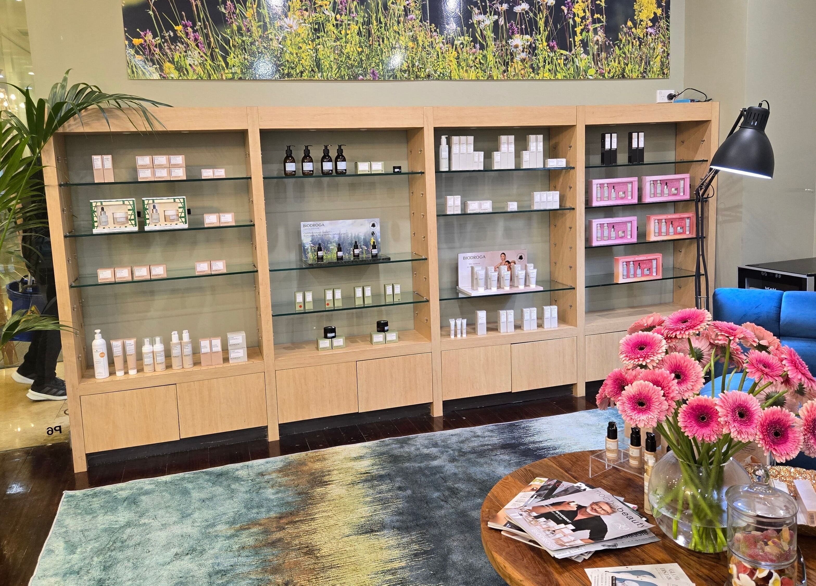 Glow District Beauty in Sydney, New South Wales, AU featuring elegant product display and vibrant flowers.