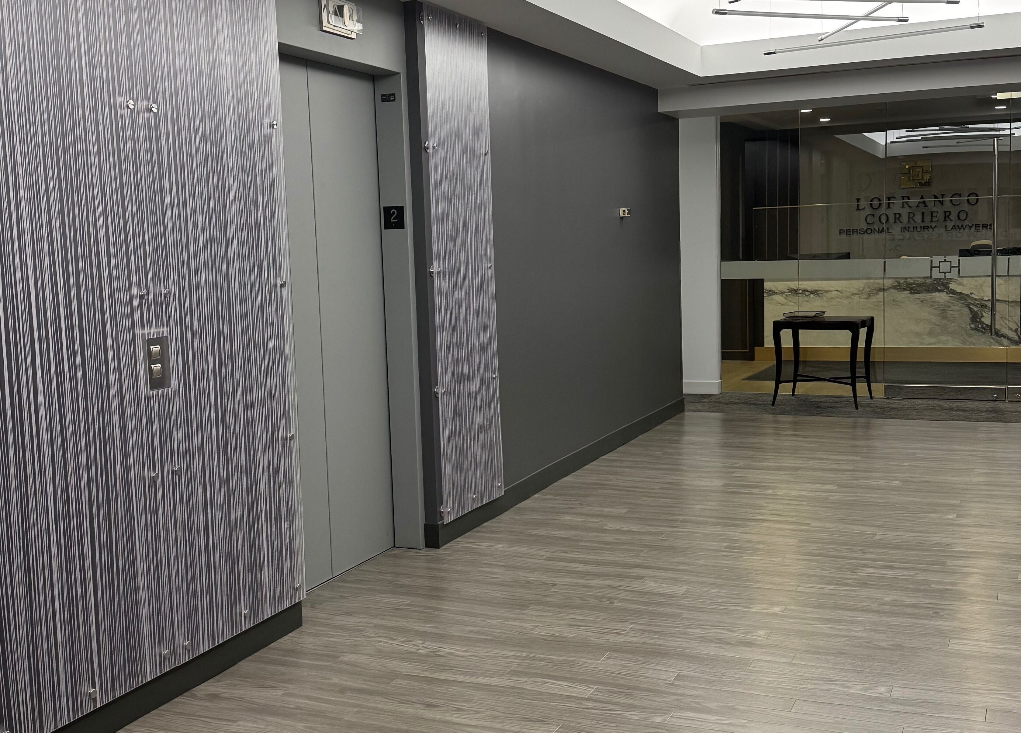 Modern hallway at LV Aestheticca, Toronto, Ontario, CA with sleek design elements.