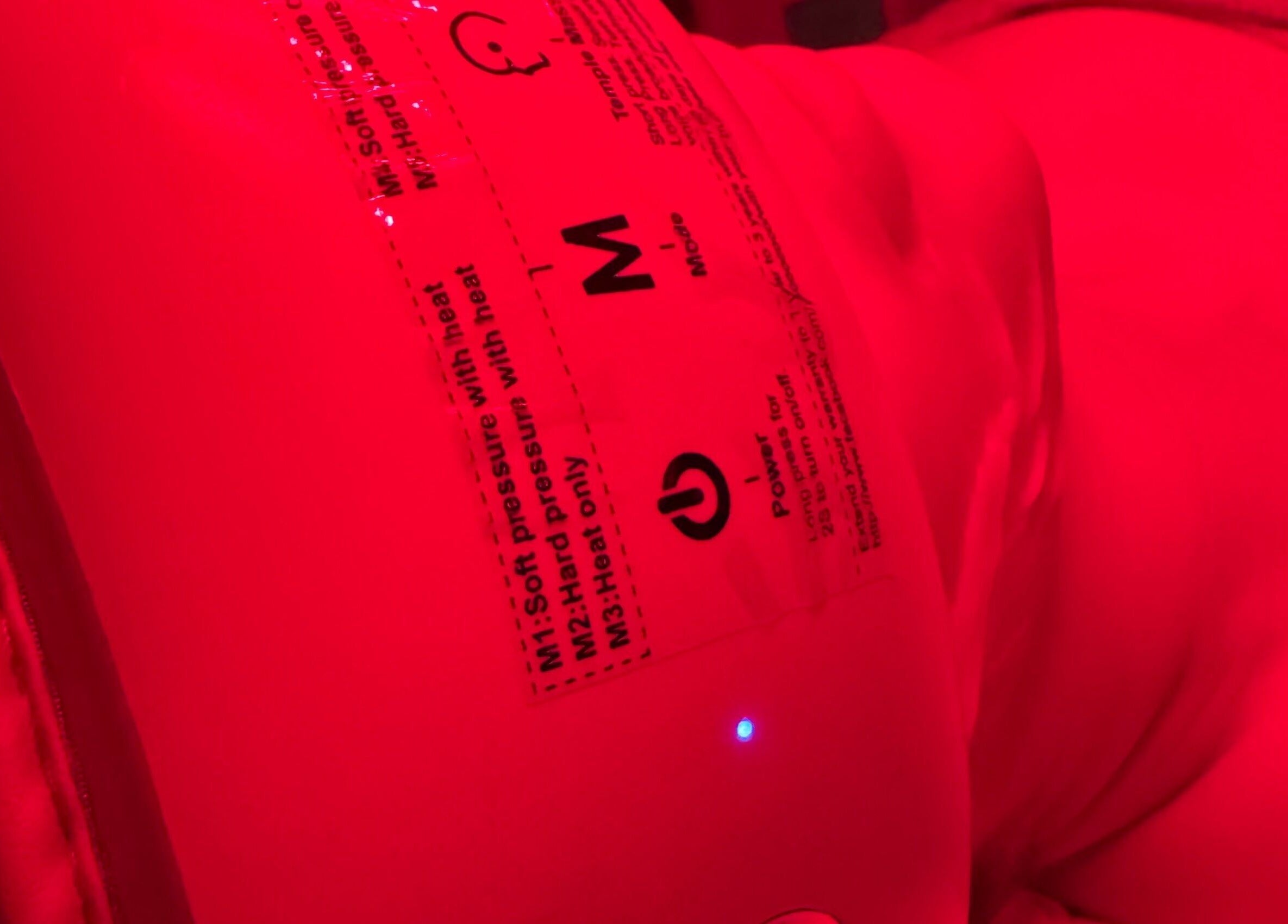 Infrared therapy device glowing red at LV Aestheticca in Toronto, Ontario, CA.