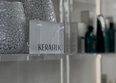 Kerasilk products in Page28 Hair Salon, Port Jefferson Station, New York, US, elegantly displayed on shelves.