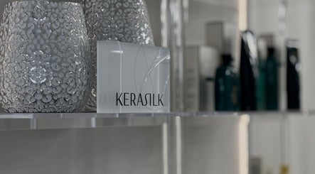 Kerasilk products in Page28 Hair Salon, Port Jefferson Station, New York, US, elegantly displayed on shelves.