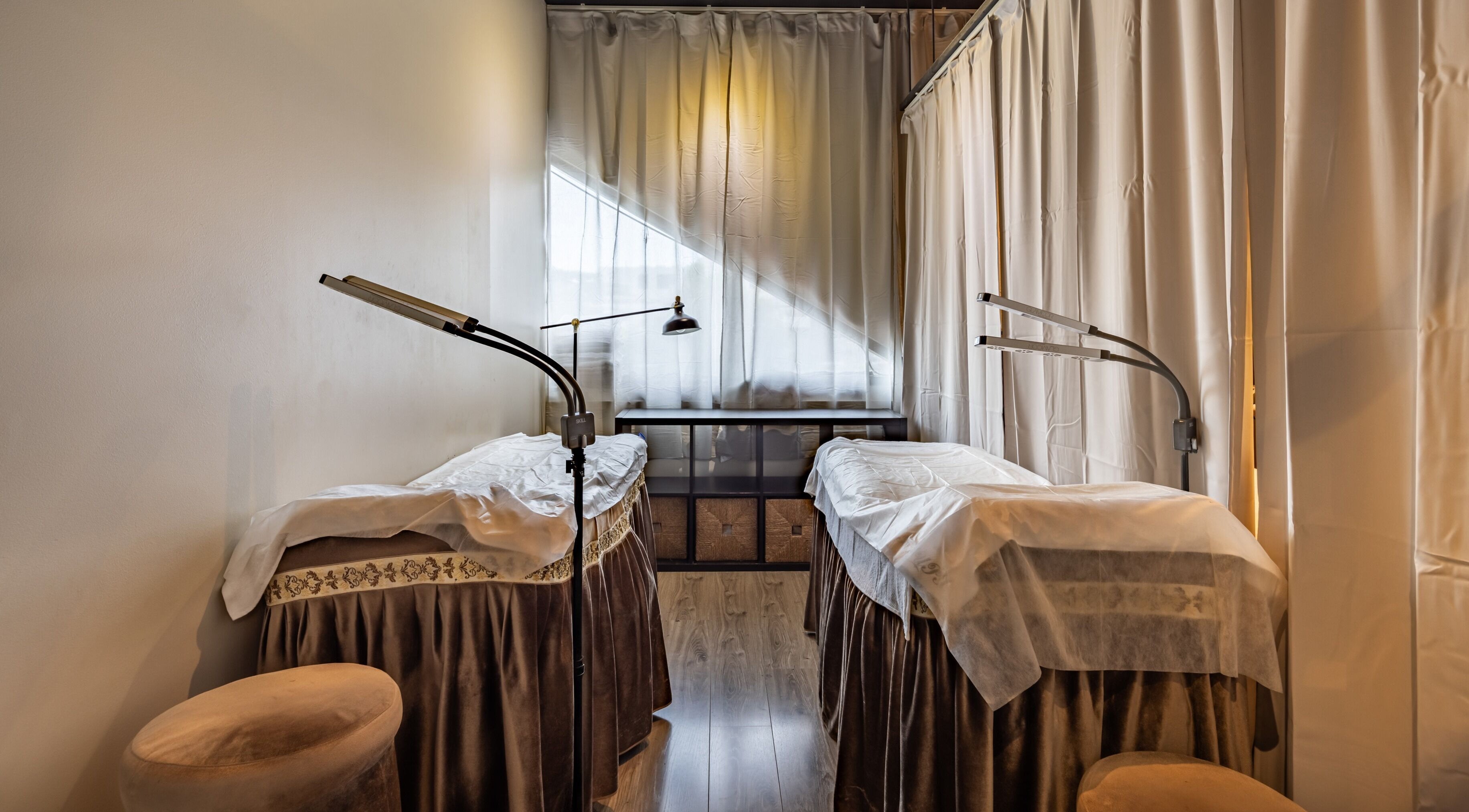 Peaceful treatment room at Bao Beauty in Burwood, New South Wales, AU featuring two massage beds.