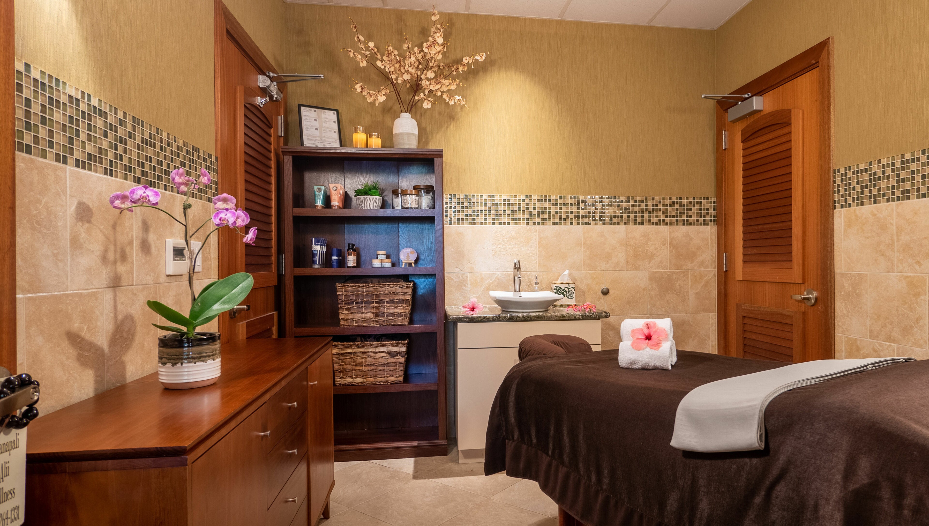 Serene spa room at Kaanapali Alii Wellness, Lahaina, Hawaii, US, featuring a massage table and calming decor.