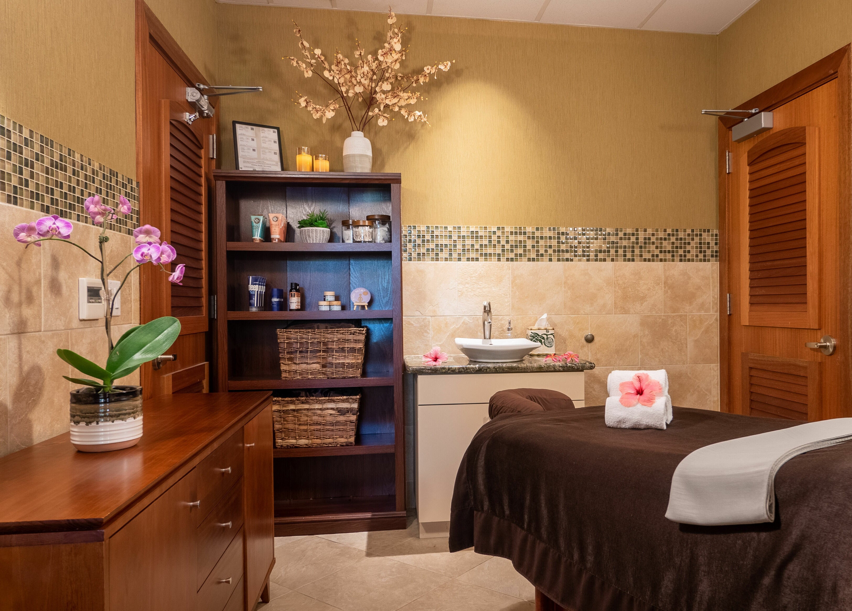 Serene spa room at Kaanapali Alii Wellness, Lahaina, Hawaii, US, featuring a massage table and calming decor.