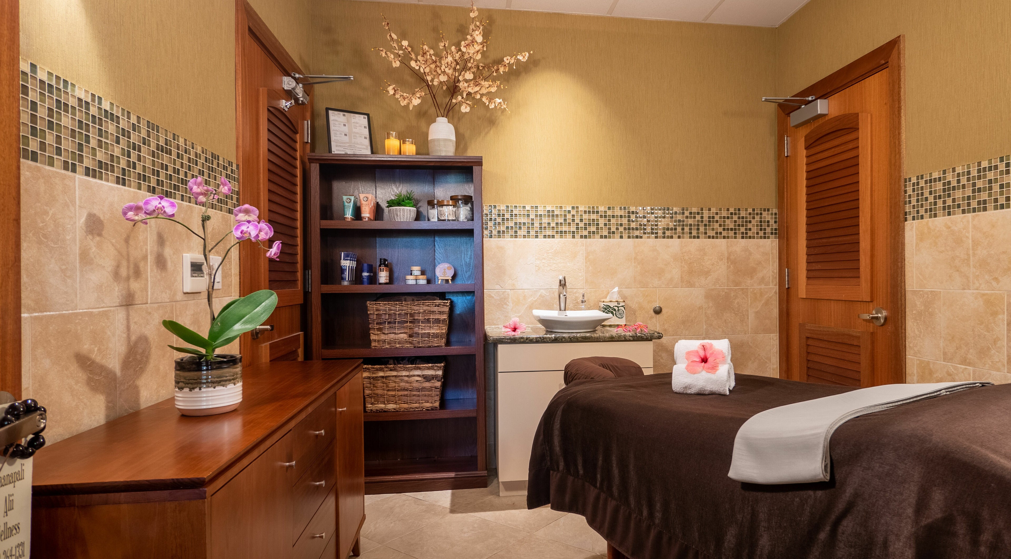 Serene spa room at Kaanapali Alii Wellness, Lahaina, Hawaii, US, featuring a massage table and calming decor.
