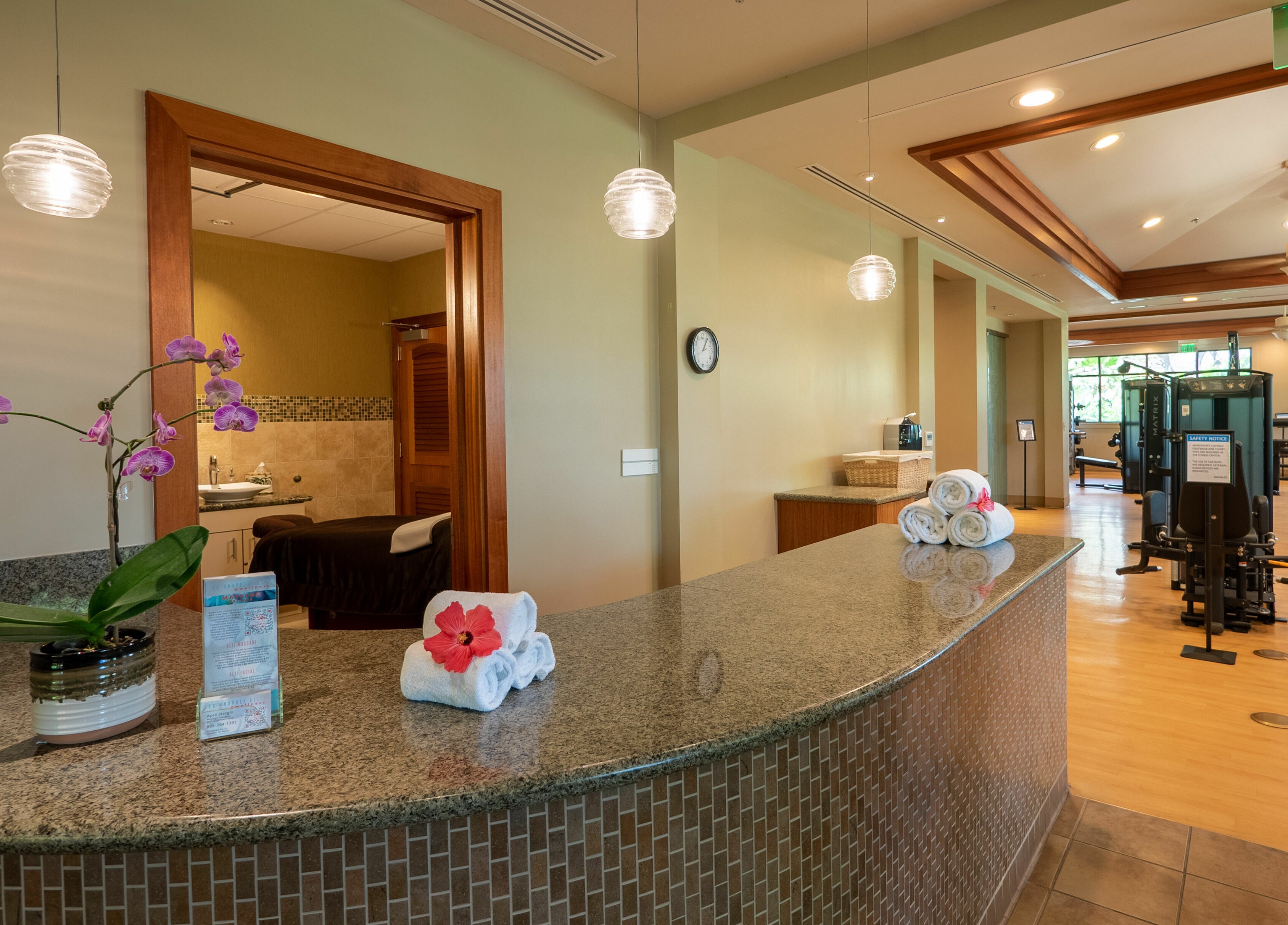 Kaanapali Alii Wellness spa reception in Lahaina, Hawaii, US with elegant decor and gym area.
