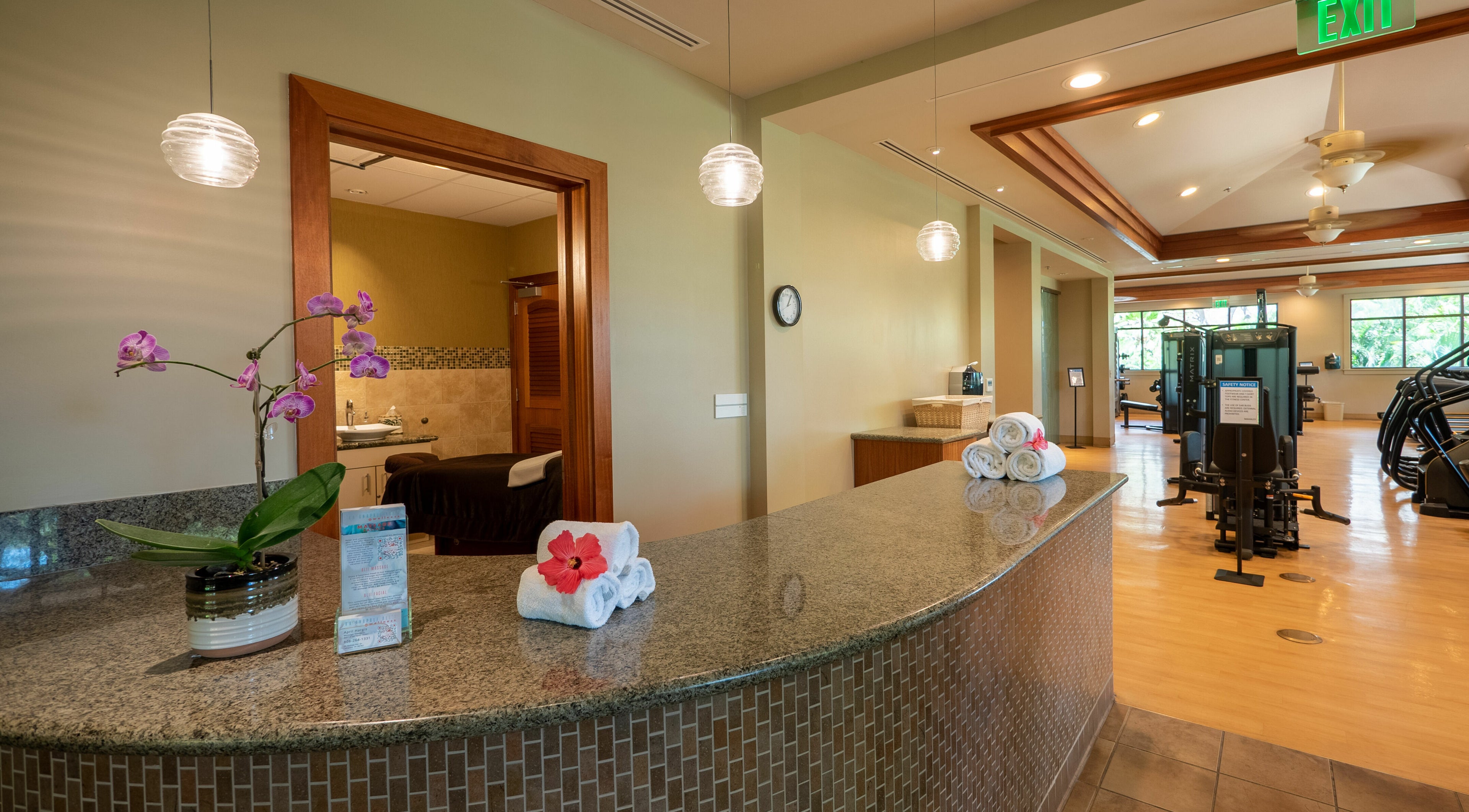 Kaanapali Alii Wellness spa reception in Lahaina, Hawaii, US with elegant decor and gym area.