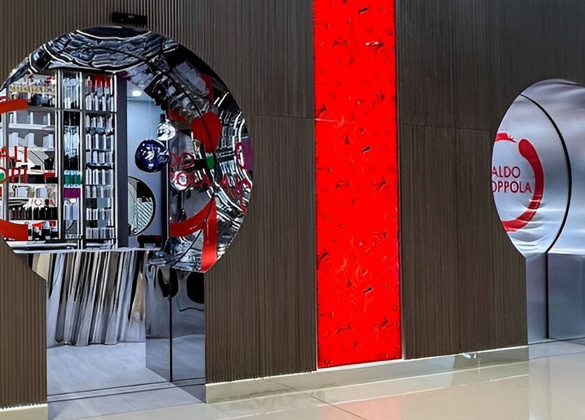 Modern entrance of Aldo Coppola Salon in Dubai, Dubai, AE with sleek design and vibrant branding.