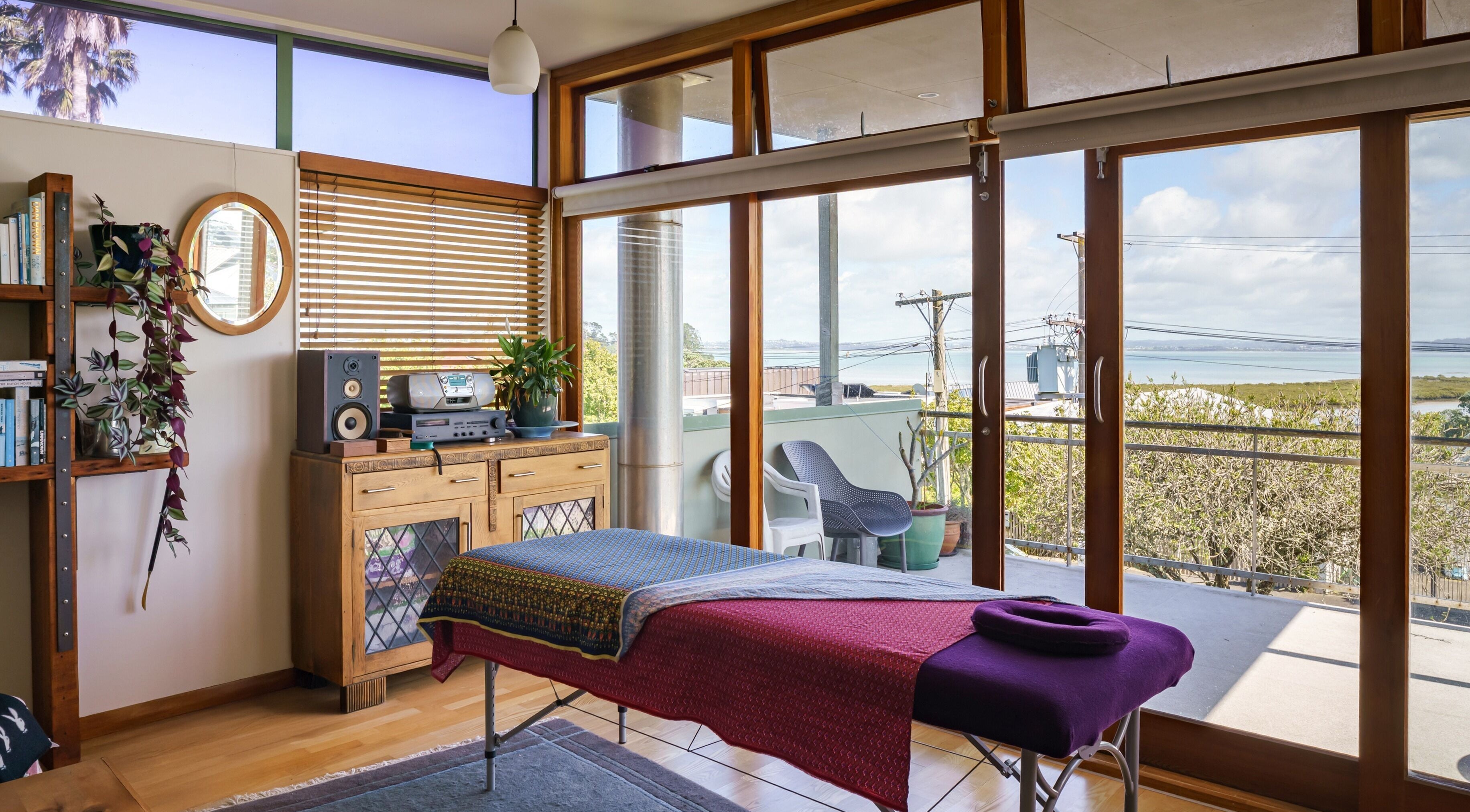 Tranquil massage space at Mob Mass- Mobile Massage Therapy in Auckland, NZ with a scenic view.