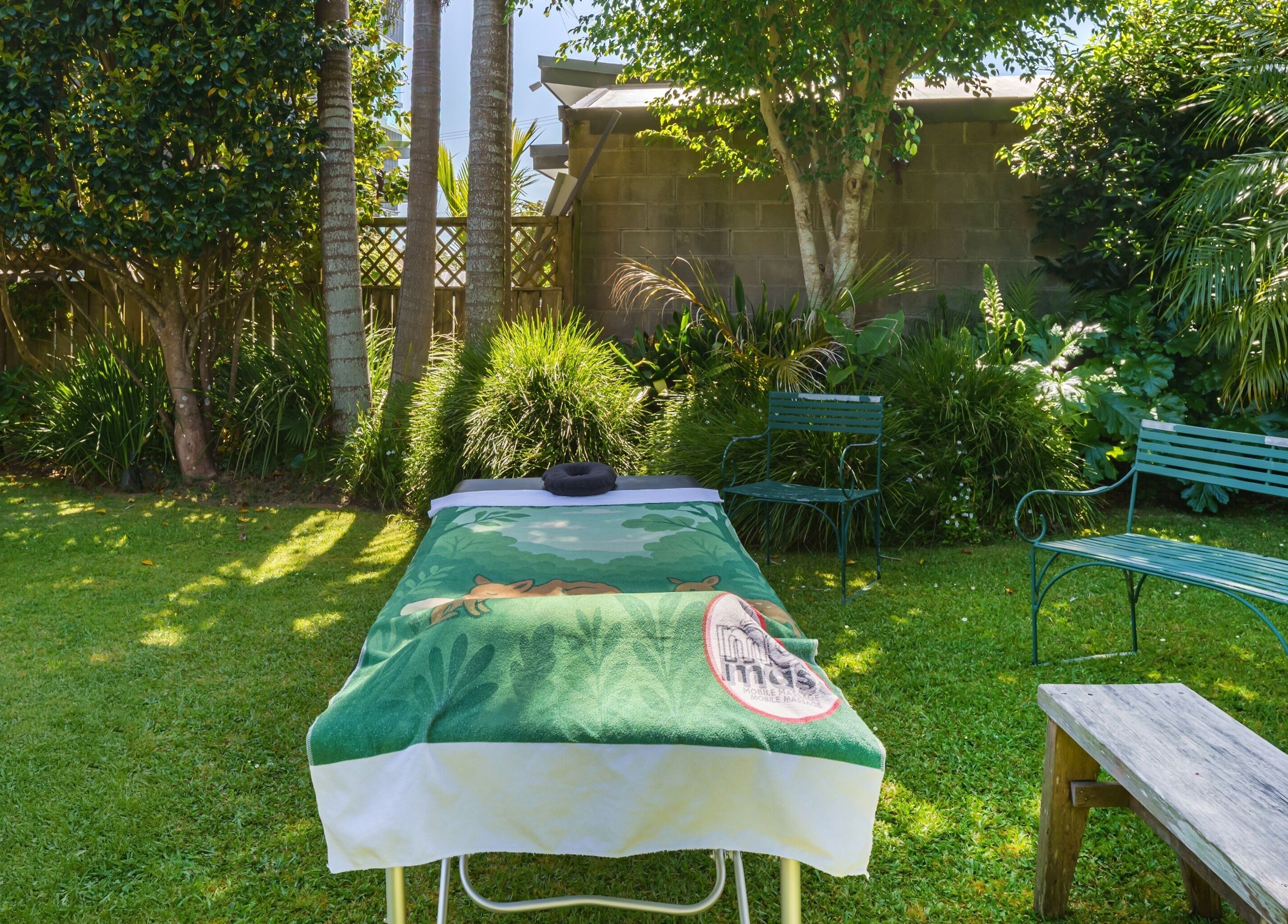Relaxing massage setup in lush garden at Mob Mass- Mobile Massage Therapy, Auckland, Auckland, NZ.