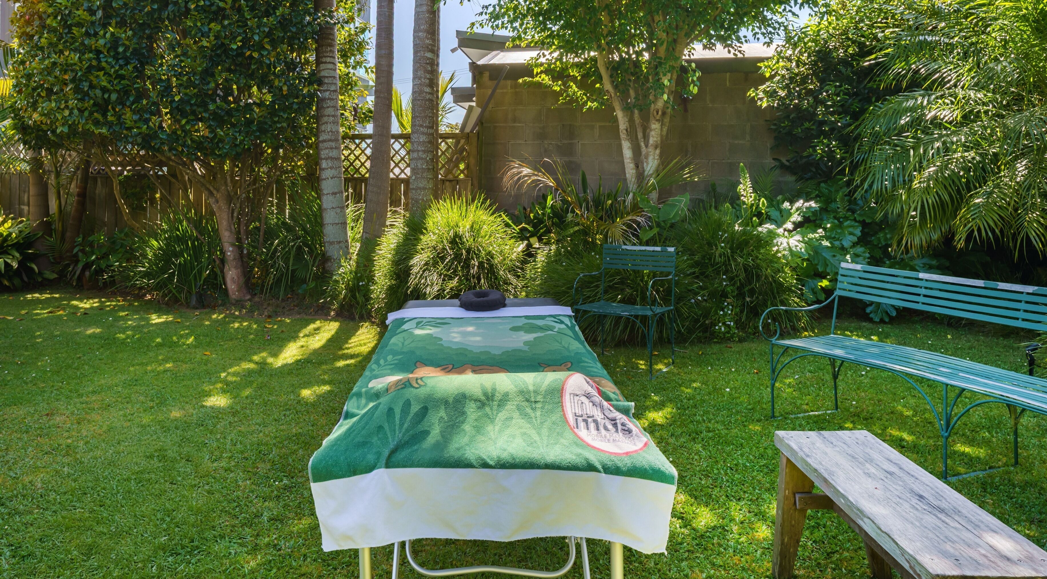 Relaxing massage setup in lush garden at Mob Mass- Mobile Massage Therapy, Auckland, Auckland, NZ.