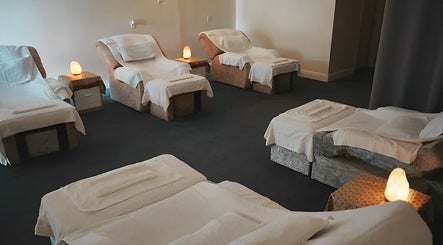 Tranquil relaxation area with massage chairs at Eden Spa Massage and Facial in Pembroke Pines, Florida, US.