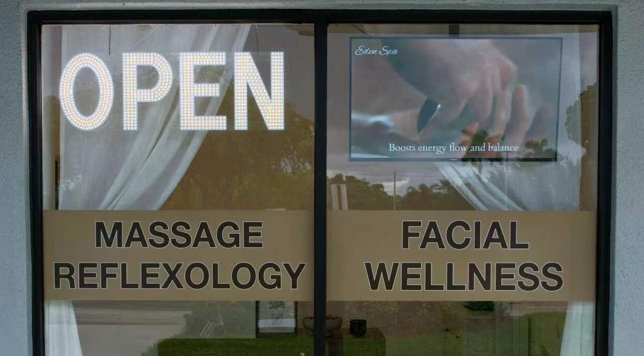 Entrance of Eden Spa Massage and Facial in Pembroke Pines, Florida, US with open sign and wellness services.