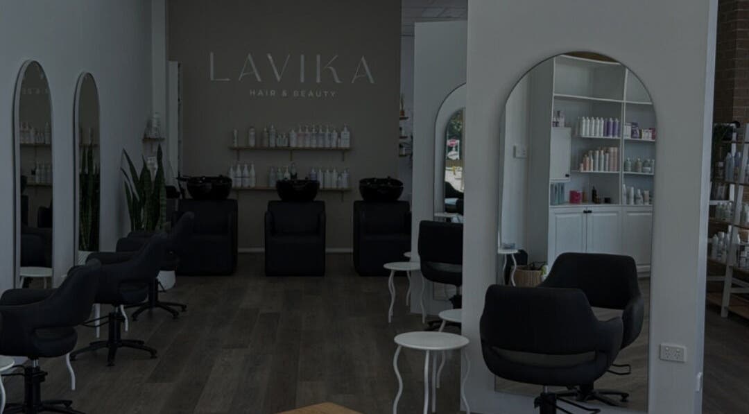 Spacious salon interior at Hair By Jenna Lutgens, Melbourne, Victoria, AU, featuring modern styling chairs and mirrors.