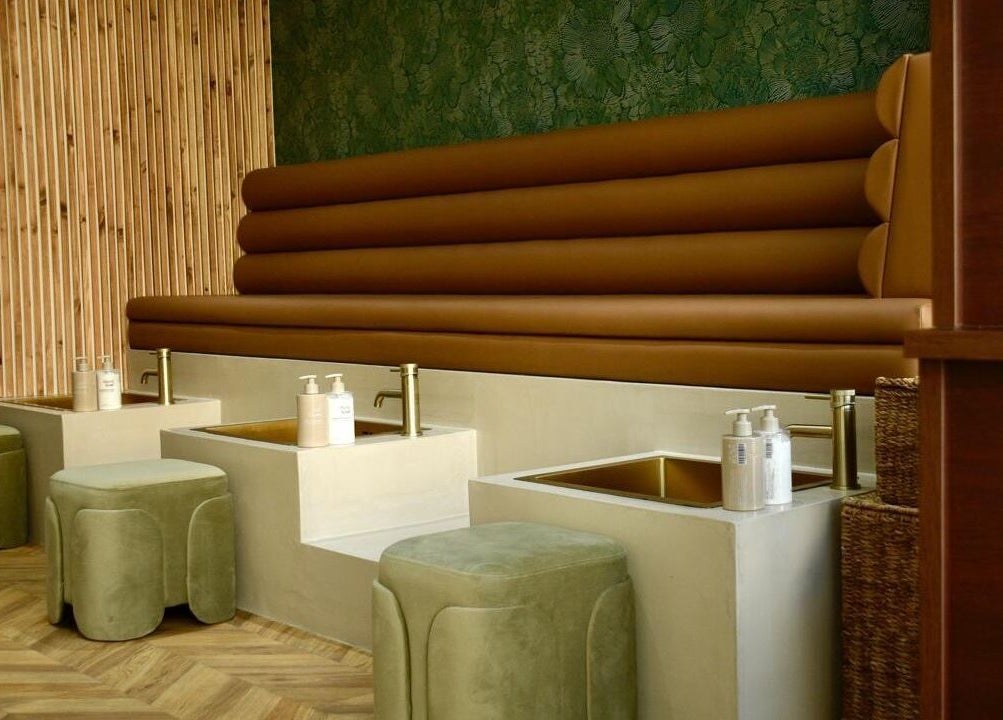 Luxurious pedicure seats at SOAK, a top beauty venue in London, England, GB featuring stylish decor.