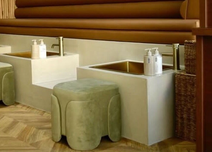 Elegant pedicure setup at SOAK, London, England, GB with plush seating and amenities.