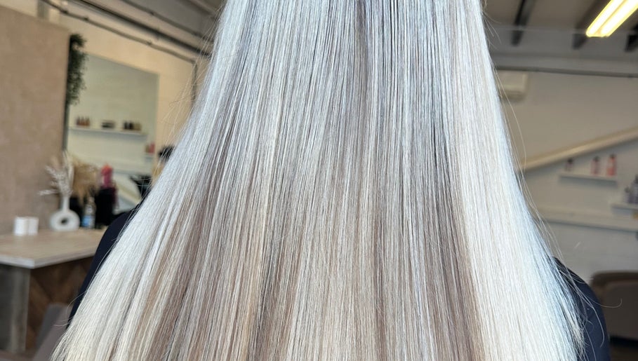 Elegant long blonde hair at Angel Locks salon in Bournemouth, England, GB, styled to perfection.