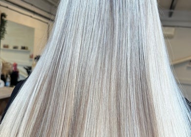 Elegant long blonde hair at Angel Locks salon in Bournemouth, England, GB, styled to perfection.