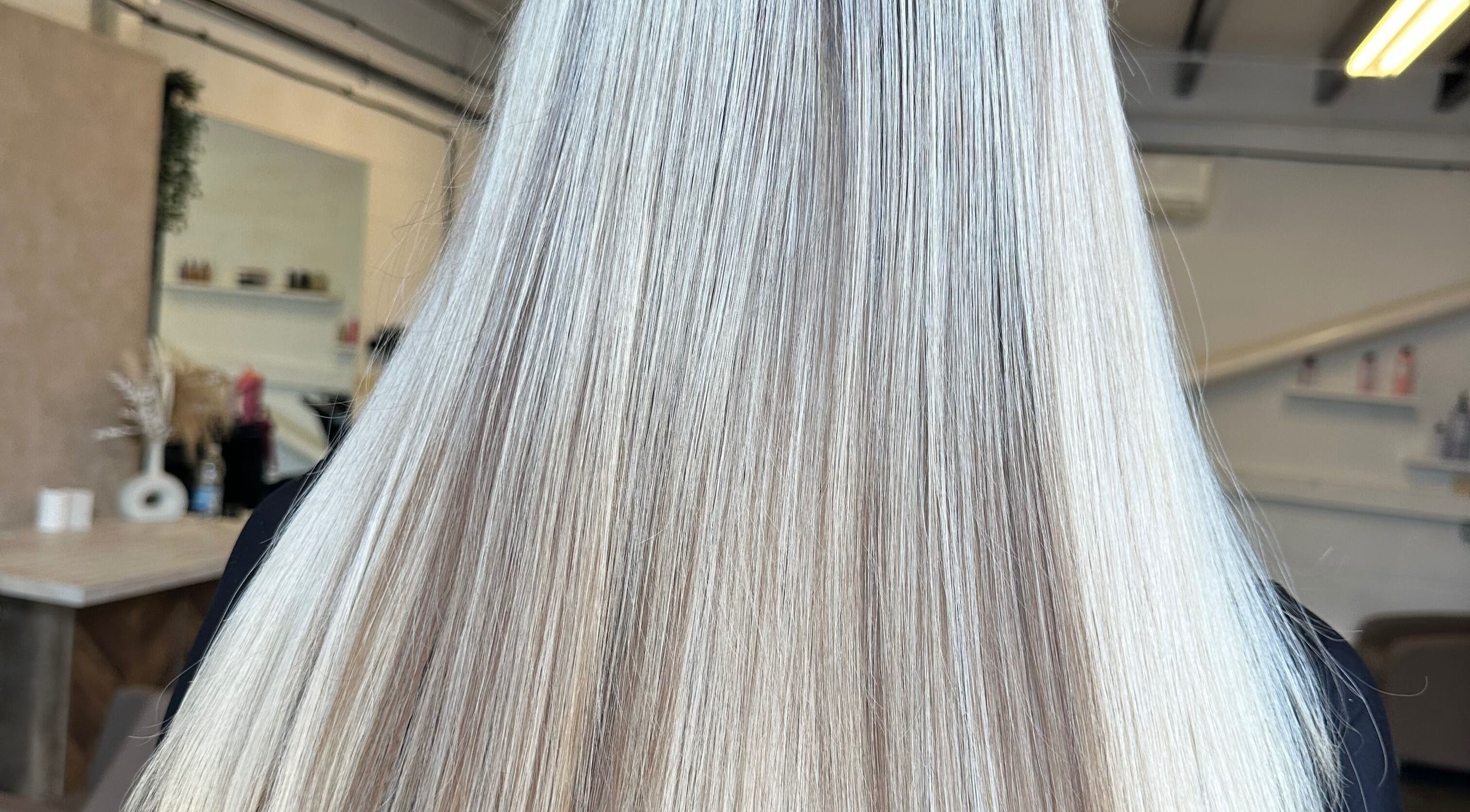 Elegant long blonde hair at Angel Locks salon in Bournemouth, England, GB, styled to perfection.