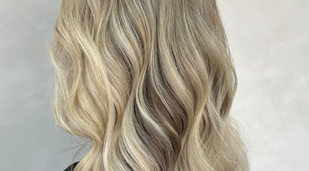 Blonde wavy hair styled at Angel Locks, Bournemouth, England, GB, showcasing salon expertise.