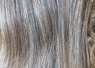 Smooth, shiny hair styled at Angel Locks in Bournemouth, England, GB, showcasing high-quality hair treatment.