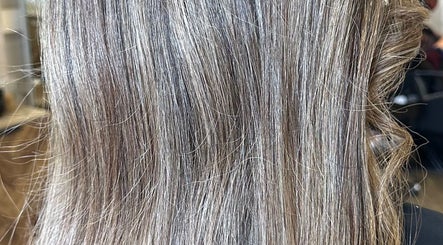 Smooth, shiny hair styled at Angel Locks in Bournemouth, England, GB, showcasing high-quality hair treatment.