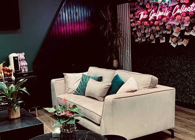 Relax in the stylish lounge at The Galpals Collective in Douglas, Douglas, IM, featuring chic decor and cozy seating.