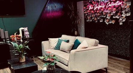 Relax in the stylish lounge at The Galpals Collective in Douglas, Douglas, IM, featuring chic decor and cozy seating.