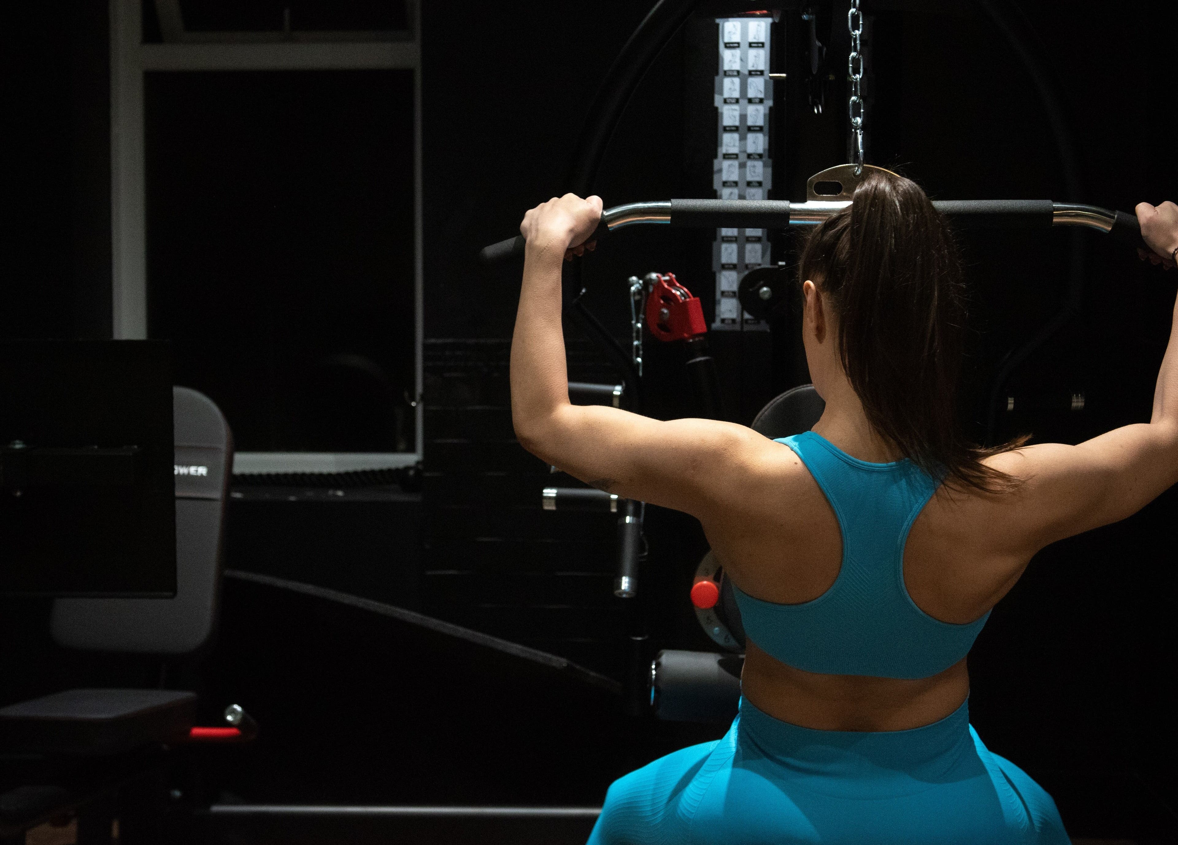 A woman in blue activewear working out at The Galpals Collective - Douglas, Isle of Man, Douglas, IM.